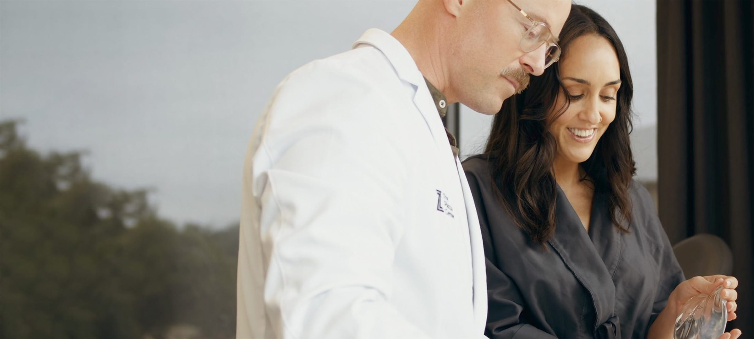 Dr. Piazza speaking with a female patient