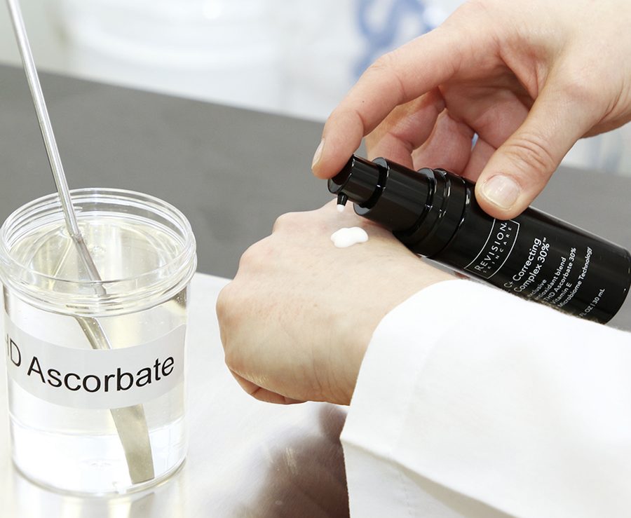 A woman pumping lotion onto her hand